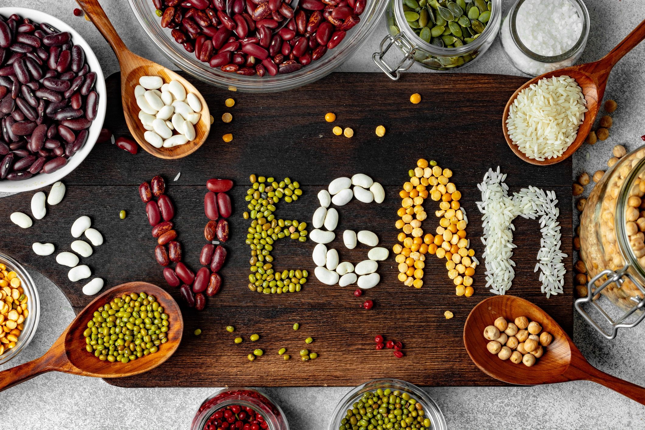 Mix of grains and beans arranged to spell vegan